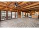 Expansive covered patio featuring brick flooring, wood ceilings, and multiple entrances to the interior at 1271 Old Mill Rd, Orlando, FL 32806