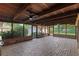Spacious screened in patio with brick flooring and wood ceiling at 1271 Old Mill Rd, Orlando, FL 32806