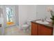 Modern bathroom featuring stained glass, tile floors, and a tiled shower at 13631 Via Roma Cir, Clermont, FL 34711