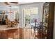 Cozy living room with view of dining area and sliding glass doors to covered patio at 13631 Via Roma Cir, Clermont, FL 34711