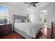 Spacious main bedroom with elegant furnishings, hardwood floors, and tranquil natural light at 13631 Via Roma Cir, Clermont, FL 34711