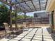 Outdoor patio area with comfortable seating and beautiful pergola at 13631 Via Roma Cir, Clermont, FL 34711