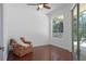 Cozy room featuring wood floors, view of the pool, lots of natural light and comfortable seating at 13631 Via Roma Cir, Clermont, FL 34711