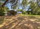 Spacious backyard featuring a screened-in porch and plenty of green space at 13794 Sw 112Th St, Dunnellon, FL 34432