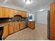 Well-appointed kitchen with wooden cabinetry and stainless steel appliances at 13794 Sw 112Th St, Dunnellon, FL 34432