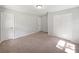 Bright bedroom features neutral carpet and fresh paint, creating a peaceful retreat at 13794 Sw 112Th St, Dunnellon, FL 34432