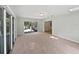 Sunroom with sliding glass doors leading to the outdoors and neutral-toned carpet at 13794 Sw 112Th St, Dunnellon, FL 34432