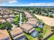 Expansive aerial view of the neighborhood with homes featuring private pools and lush green lawns at 1478 Moon Valley Dr, Davenport, FL 33896