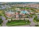 Aerial view of a large community pool area with a clubhouse at 1478 Moon Valley Dr, Davenport, FL 33896