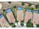 Aerial view of multiple homes, surrounded by pools and trees at 1478 Moon Valley Dr, Davenport, FL 33896