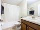 Bathroom featuring a vanity with sink, toilet, tub, shower and tile flooring at 1478 Moon Valley Dr, Davenport, FL 33896