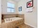 Elegant bathroom features a tiled soaking tub with modern fixtures and a large window for natural light at 1478 Moon Valley Dr, Davenport, FL 33896