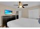 Bedroom with dresser, queen size bed, and view of the ensuite bath at 1478 Moon Valley Dr, Davenport, FL 33896