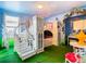 Unique castle-themed bedroom with stairs leading to a lofted bed and adjacent vanity area at 1478 Moon Valley Dr, Davenport, FL 33896
