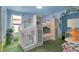 A whimsical bedroom with a castle-themed bed and playful decor, creating a magical space for children at 1478 Moon Valley Dr, Davenport, FL 33896