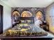 A bedroom with Harry Potter themed wall art, dark wood furniture, and laminate flooring at 1478 Moon Valley Dr, Davenport, FL 33896