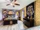 Bedroom with Harry Potter themed tapestry and wall art, a ceiling fan and laminate flooring at 1478 Moon Valley Dr, Davenport, FL 33896