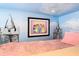 Themed bedroom featuring a custom princess-themed castle bed, adding a magical touch to the space at 1478 Moon Valley Dr, Davenport, FL 33896