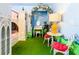 Charming castle-themed bedroom with loft bed, floral arch, vanity, and play space at 1478 Moon Valley Dr, Davenport, FL 33896