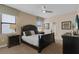 Bedroom featuring a queen bed, dark wood furniture, and neutral walls at 1478 Moon Valley Dr, Davenport, FL 33896
