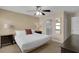 Bedroom with a comfortable bed, side tables, and an ensuite bathroom, creating a private retreat at 1478 Moon Valley Dr, Davenport, FL 33896