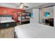Spacious bedroom featuring a mix of bed sizes, creative decor, and connected to an adjacent bonus room at 1478 Moon Valley Dr, Davenport, FL 33896