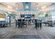 Interior of community center showing bar seating and tables with chairs at 1478 Moon Valley Dr, Davenport, FL 33896