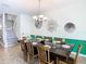 Formal dining room showcasing an elegant chandelier and a fully set table for a luxurious dining experience at 1478 Moon Valley Dr, Davenport, FL 33896