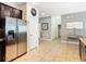 Open view of the hallway featuring tile floors leading to multiple rooms with neutral paint at 1478 Moon Valley Dr, Davenport, FL 33896