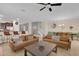 Open-concept living room and kitchen provides ample space for entertaining with multiple seating options at 1478 Moon Valley Dr, Davenport, FL 33896