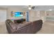 Spacious living room featuring sleek furnishings, wall decor, and durable wood-look floors at 1478 Moon Valley Dr, Davenport, FL 33896