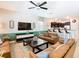 Spacious living room with comfortable seating, modern decor, and an open view to the kitchen at 1478 Moon Valley Dr, Davenport, FL 33896