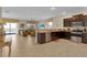 View of open concept layout with kitchen overlooking the living area and pool access at 1478 Moon Valley Dr, Davenport, FL 33896
