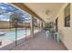 View of the screened-in pool from the covered patio featuring brick pavers and ceiling fans at 1478 Moon Valley Dr, Davenport, FL 33896