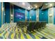 Theater room equipped with comfortable seating and large screen, providing an immersive viewing experience at 1478 Moon Valley Dr, Davenport, FL 33896