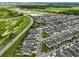 An aerial view of a well-designed community with green spaces, a lake, and modern homes at 14955 Lebeau Loop, Winter Garden, FL 34787