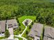 Aerial view of a neighborhood playground surrounded by green space and trees, creating a serene and Gathering-friendly environment at 14955 Lebeau Loop, Winter Garden, FL 34787