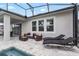 Spacious back patio featuring comfortable seating and lounging options, ideal for outdoor relaxation and entertainment at 14955 Lebeau Loop, Winter Garden, FL 34787