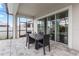 Inviting covered back patio with a dining table, ideal for outdoor entertaining and relaxation at 14955 Lebeau Loop, Winter Garden, FL 34787