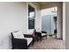 Cozy front porch featuring comfortable seating, offering a relaxing outdoor space and a welcoming ambiance at 14955 Lebeau Loop, Winter Garden, FL 34787