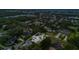 Stunning aerial view of a luxury home showcasing a private pool, lush landscaping, and elegant architectural design at 15198 E Oakland Ave, Winter Garden, FL 34787