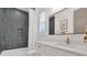 Updated bathroom with sleek vanity, stylish gold hardware, and a shower-tub combo at 15198 E Oakland Ave, Winter Garden, FL 34787