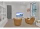 Relaxing living room with a TV, neutral colors, and comfortable seating arrangements at 15198 E Oakland Ave, Winter Garden, FL 34787