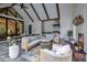 Covered patio with a complete outdoor kitchen, seating area, and a fireplace at 15198 E Oakland Ave, Winter Garden, FL 34787