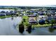 Wide shot of the community, showing the lake view, surrounding homes and beautiful Florida landscape at 15510 Lake Burnett Shore Ct, Winter Garden, FL 34787
