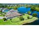 An aerial view showcases the home's waterfront property with a fenced yard and screened-in patio at 15510 Lake Burnett Shore Ct, Winter Garden, FL 34787