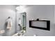 Stylish bathroom with a decorative shelf and a mirror hanging above the modern-style sink at 15510 Lake Burnett Shore Ct, Winter Garden, FL 34787