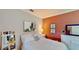 Bedroom with white furniture, art, and decorations at 15510 Lake Burnett Shore Ct, Winter Garden, FL 34787