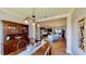 Dining room features a wooden table and chairs, chandelier, hardwood floors, and built in hutch at 15510 Lake Burnett Shore Ct, Winter Garden, FL 34787