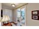 Inviting entryway leading to a bright living room with plantation shutters and a comfortable sofa at 15510 Lake Burnett Shore Ct, Winter Garden, FL 34787
